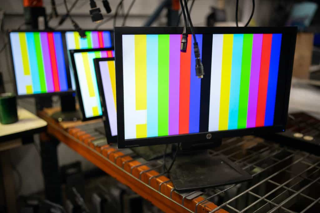 Computer monitors are tested in the display department at Repowered